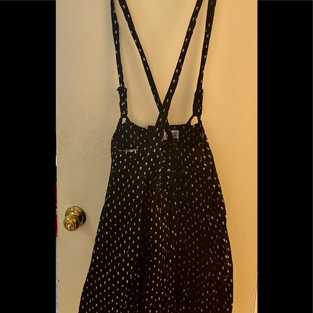 1X skull print black corduroy skirt with suspenders from Unique Vintage.